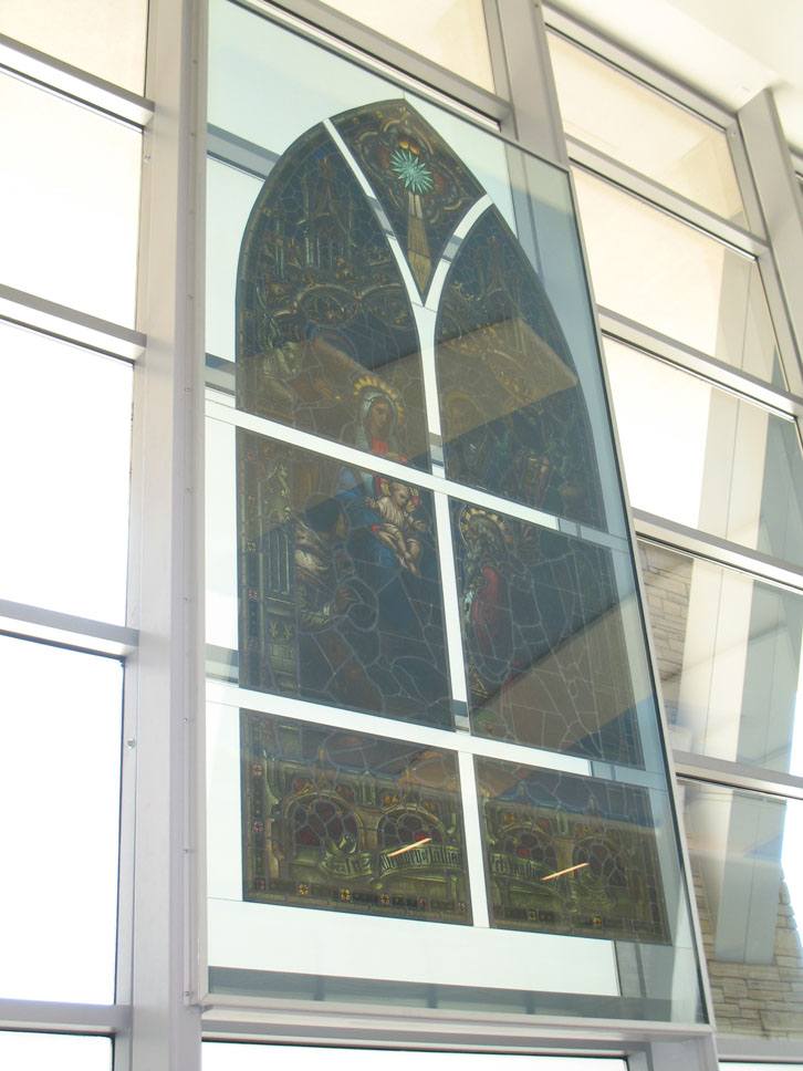 St. Francis Hospital — historic stained glass panel set in modern curtain wall