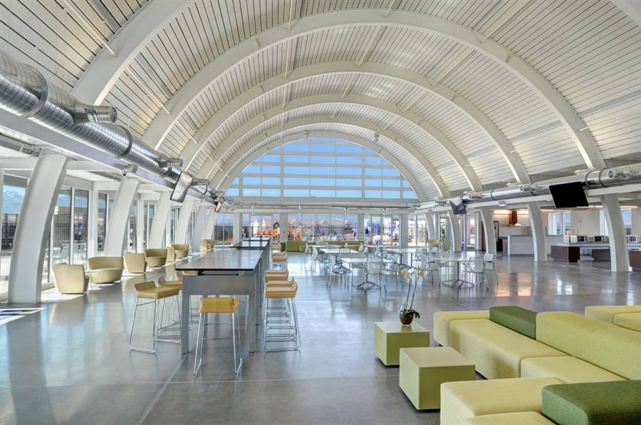 Bal Seal Engineering — day-lit interior commons with arched glass end wall
